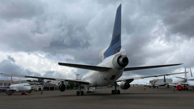 Airplane on airport under cloudy skies