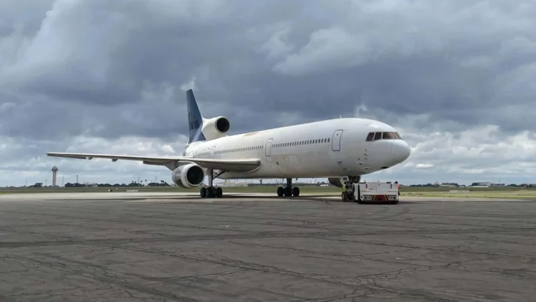Airplane on airport under cloudy skies